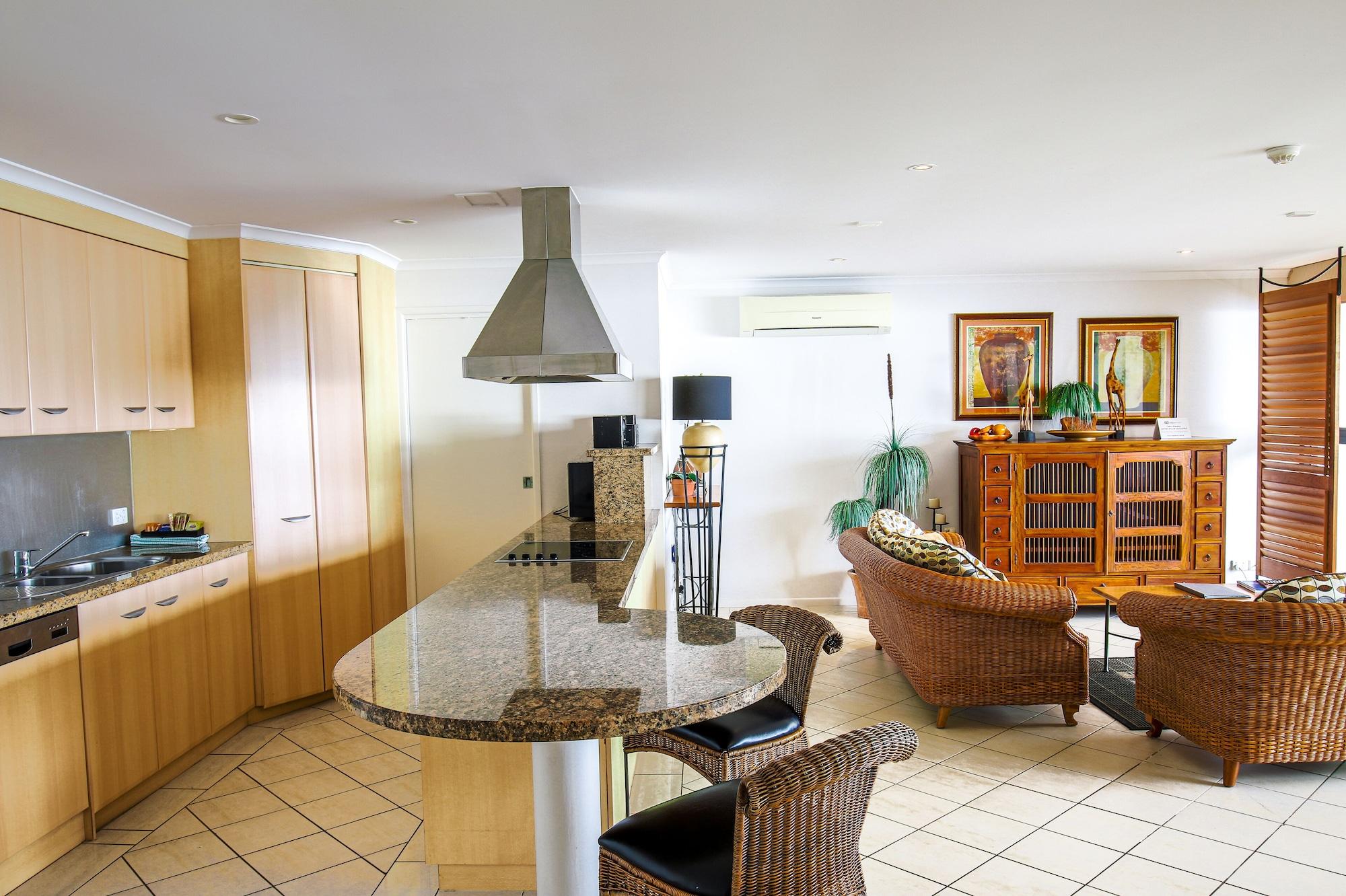 ケアンズ アクエリアスアパートホテル エクステリア 写真 A kitchen in a condominium